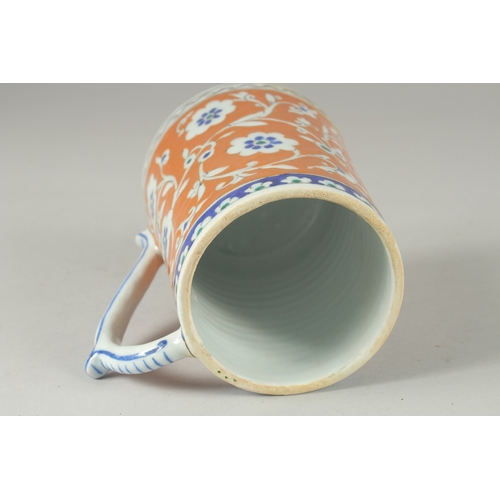 590 - AN OTTOMAN TURKISH POTTERY TANKARD, 15cm high.