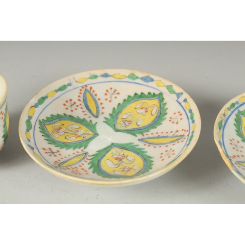 592 - A PAIR OF TURKISH KUTAHYA COFFEE CUPS AND SAUCERS, (4 pieces).