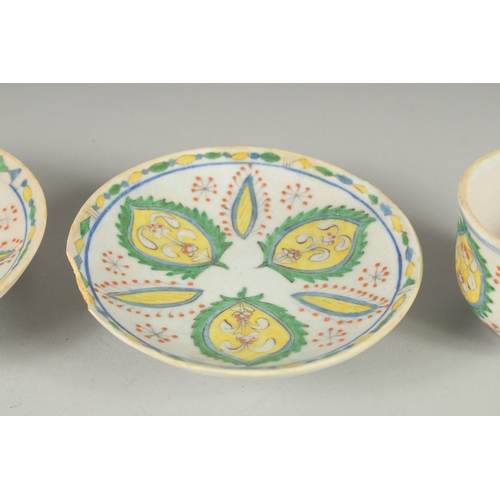 592 - A PAIR OF TURKISH KUTAHYA COFFEE CUPS AND SAUCERS, (4 pieces).