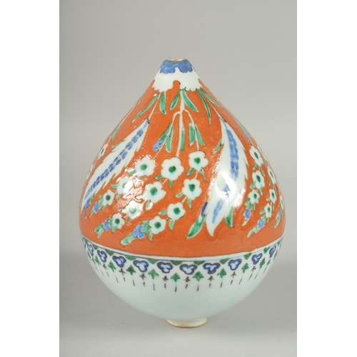 597 - AN OTTOMAN TURKISH KUTAHYA GLAZED POTTERY HANGING ORNAMENT, 20cm high.