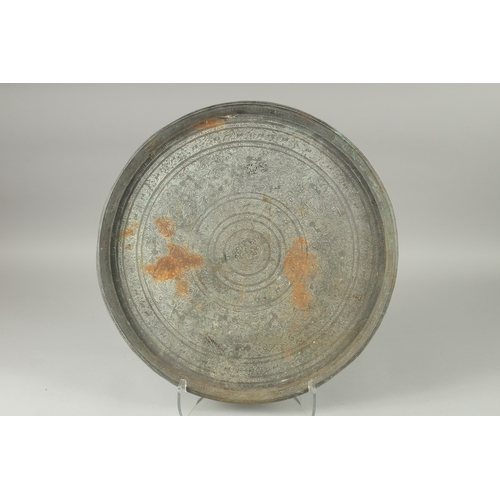 599 - AN INDIAN ENGRAVED METAL TRAY, 51cm diameter.