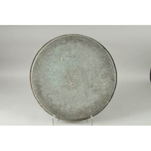 599 - AN INDIAN ENGRAVED METAL TRAY, 51cm diameter.