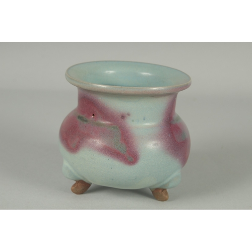 60 - A CHINESE JUN WARE PORCELAIN TRIPOD CENSER, 10cm high.