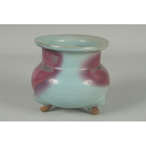 60 - A CHINESE JUN WARE PORCELAIN TRIPOD CENSER, 10cm high.