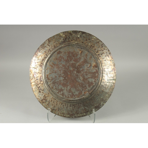 600 - A MIDDLE EASTERN ENGRAVED TINNED COPPER DISH, 43cm diameter.