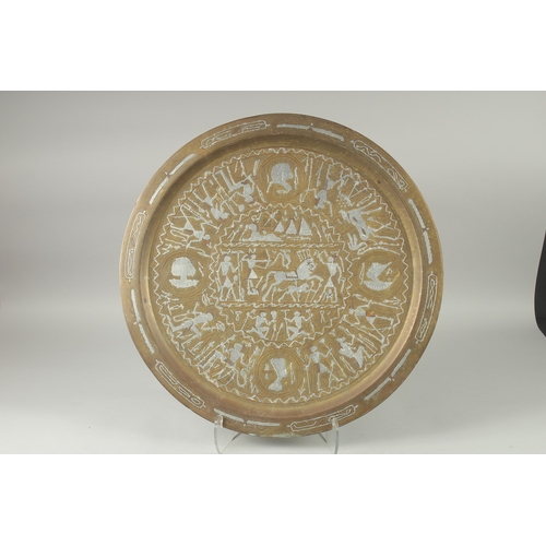 601 - AN EYGPTIAN SILVER INLAID BRASS TRAY, 60cm diameter.