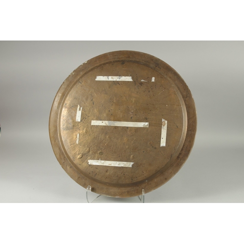 601 - AN EYGPTIAN SILVER INLAID BRASS TRAY, 60cm diameter.