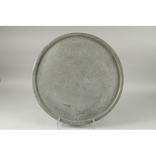 602 - A LARGE MIDDLE EASTERN ENGRAVED METAL TRAY, 57cm diameter.