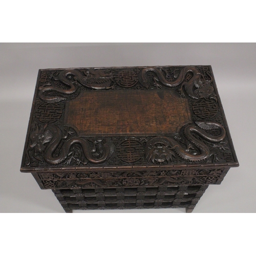 609 - AN EARLY 20TH CENTURY CHINESE HARDWOOD FOLDING DESK / TABLE, with two small drawers and folding leg ... 