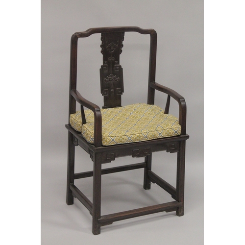 611 - A GOOD 19TH CENTURY CHINESE REDWOOD ARMCHAIR, with curving top rail, carved central splat, solid sea... 