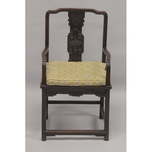 611 - A GOOD 19TH CENTURY CHINESE REDWOOD ARMCHAIR, with curving top rail, carved central splat, solid sea... 