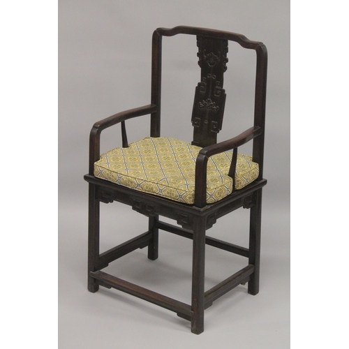 611 - A GOOD 19TH CENTURY CHINESE REDWOOD ARMCHAIR, with curving top rail, carved central splat, solid sea... 