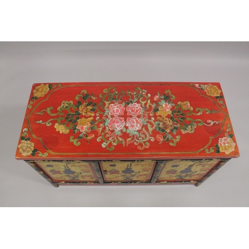 612 - A 20TH CENTURY CHINESE PAINTED LOW CUPBOARD, the rectangular top painted with flowers, similarly dec... 