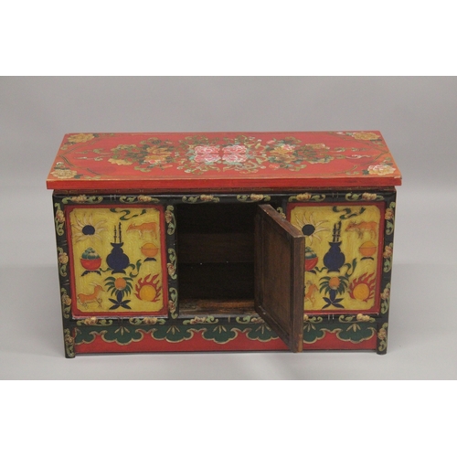 612 - A 20TH CENTURY CHINESE PAINTED LOW CUPBOARD, the rectangular top painted with flowers, similarly dec... 