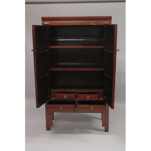 613 - A LATE 19TH - EARLY 20TH CENTURY CHINESE RED LACQUER MARRIAGE CABINET, with a pair of brass mounted ... 