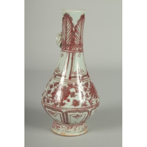 67 - A CHINESE UNDERGLAZE RED AND WHITE PORCELAIN VASE, with moulded chilong to the neck, 17cm high.