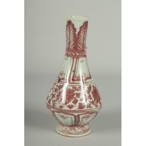 67 - A CHINESE UNDERGLAZE RED AND WHITE PORCELAIN VASE, with moulded chilong to the neck, 17cm high.