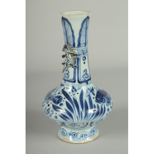 68 - A CHINESE BLUE AND WHITE PORCELAIN VASE, with moulded chilong to neck, painted with fish, 18.5cm hig... 