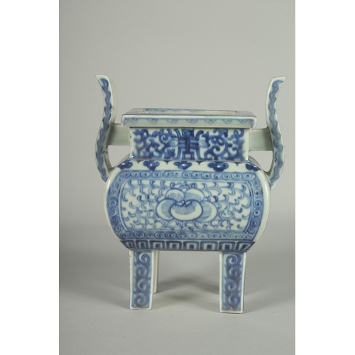 73 - A CHINESE BLUE AND WHITE PORCELAIN TWIN HANDLE CENSER, raised on four square-form feet, 19.5cm high.