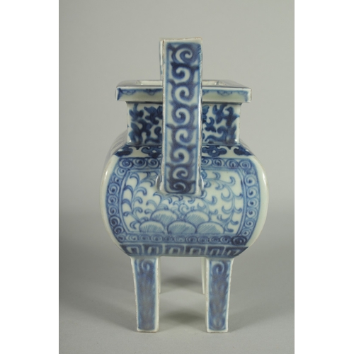 73 - A CHINESE BLUE AND WHITE PORCELAIN TWIN HANDLE CENSER, raised on four square-form feet, 19.5cm high.