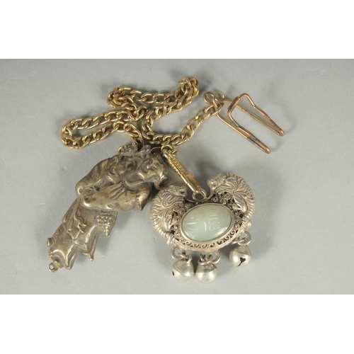 80 - A CHINESE JADE INSET WHITE PENDANT, together with another white metal pendant (2).