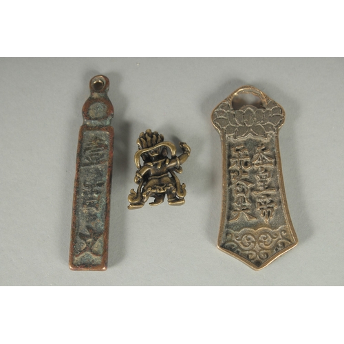 83 - THREE CHINESE BRONZE ORNAMENTS.