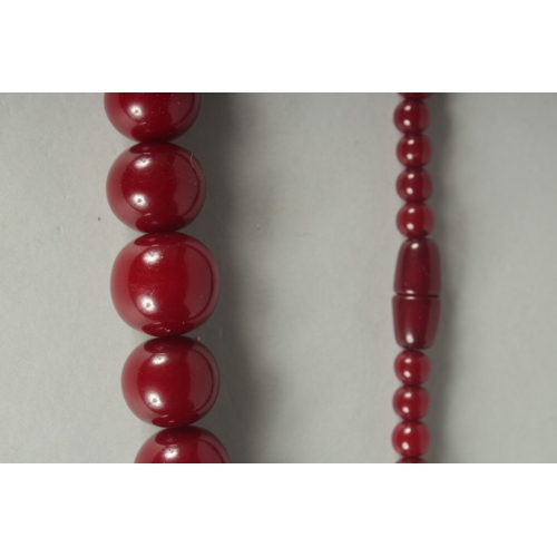 85 - A CHERRY-COLOUR BEADED NECKLACE.