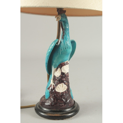 93 - A CHINESE TURQUOISE GLAZE PORCELAIN PEACOCK PHOENIX, converted to a lamp base and mounted to a circu... 