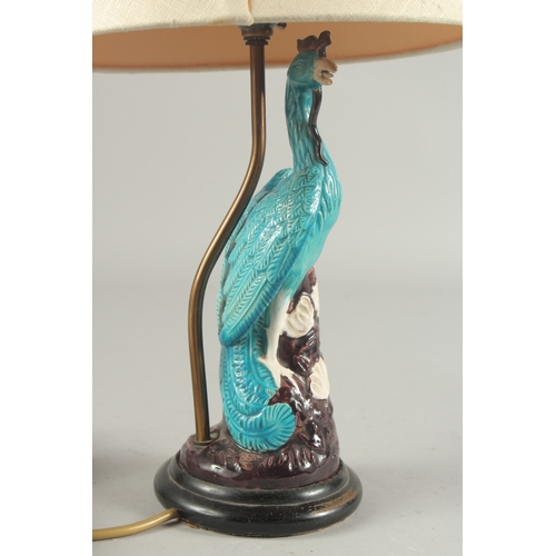 93 - A CHINESE TURQUOISE GLAZE PORCELAIN PEACOCK PHOENIX, converted to a lamp base and mounted to a circu... 