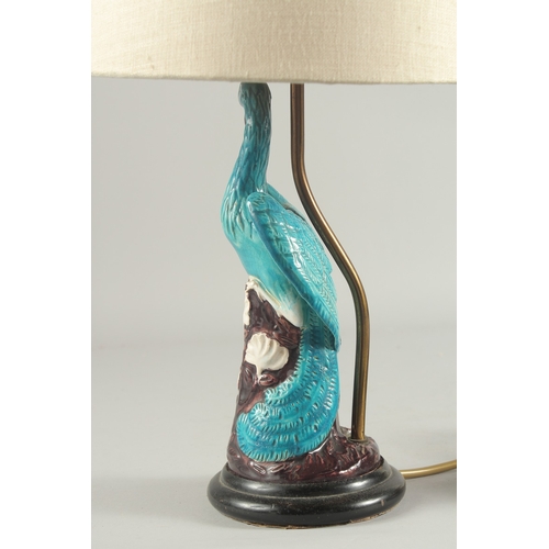 93 - A CHINESE TURQUOISE GLAZE PORCELAIN PEACOCK PHOENIX, converted to a lamp base and mounted to a circu... 