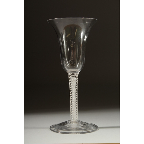 1031 - A GEORGIAN WINE GLASS with inverted bell shape bowl and white twist stem. 6ins high.