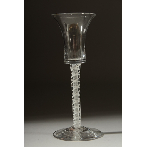 1032 - A GEORGIAN WINE GLASS with inverted bell shape bowl and white twist stem. 6ins high.