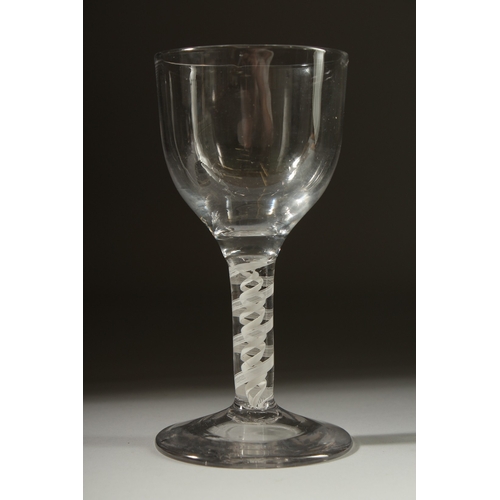 1033 - A LARGE GEORGIAN RUMMER GLASS with plain bowl. 3cms diameter and white twist stem 6.5ins high.... 