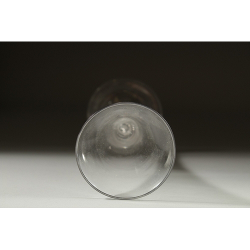 1034 - A GEORGIAN GLASS with long tapering plain bowl with white air twist stem. 7.5ins high.