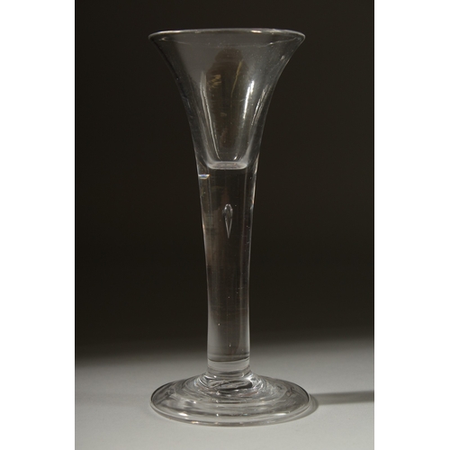 1035 - A GEORGIAN GLASS with tapering bowl and tear drop in the stem. 6.5ins high.