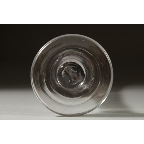 1035 - A GEORGIAN GLASS with tapering bowl and tear drop in the stem. 6.5ins high.