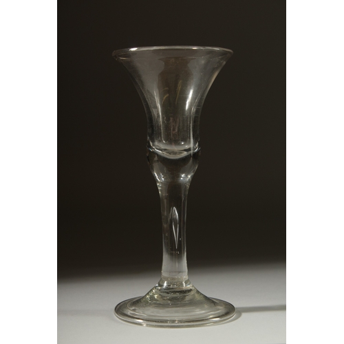 1037 - A LARGE PLAIN GEORGIAN GLASS with inverted bell shaped bowl. 6.5ins high.