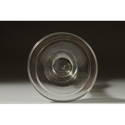 1037 - A LARGE PLAIN GEORGIAN GLASS with inverted bell shaped bowl. 6.5ins high.