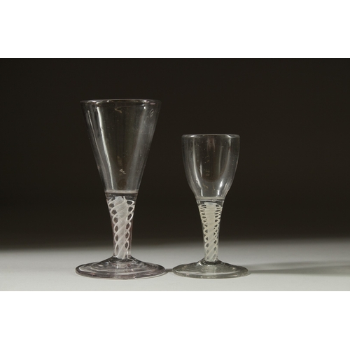 1040 - TWO SMALL GEORGIAN GLASSES both with white short stems. 4ins & 5ins high.