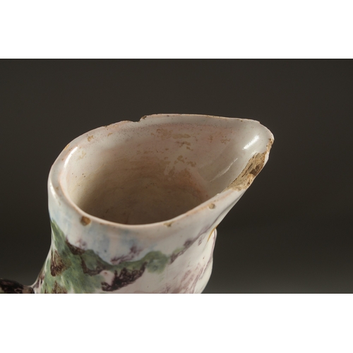 1075 - AN EARLY FAIENCE SPONGEWARE JUG. 9.5ins high.