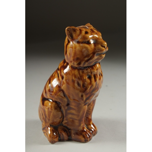 1078 - A TREACLE GLAZED CAT MONEY BOX. 5.5ins high.