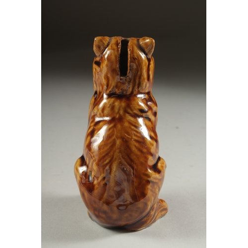 1078 - A TREACLE GLAZED CAT MONEY BOX. 5.5ins high.