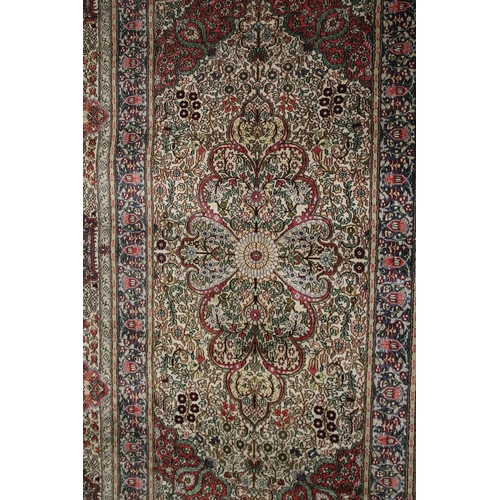 1002 - A GOOD SMALL PERSIAN SILK RUG cream ground with all over floral design. 5ft x 3ft 1ins.