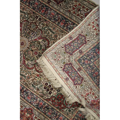 1002 - A GOOD SMALL PERSIAN SILK RUG cream ground with all over floral design. 5ft x 3ft 1ins.