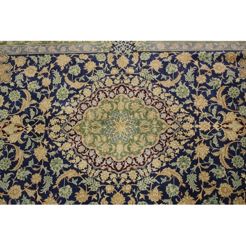 1003 - A GOOD SMALL PERSIAN SILK RUG blue ground with stylised floral decoration, with a similar green grou... 