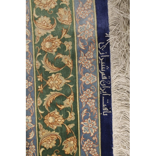 1003 - A GOOD SMALL PERSIAN SILK RUG blue ground with stylised floral decoration, with a similar green grou... 