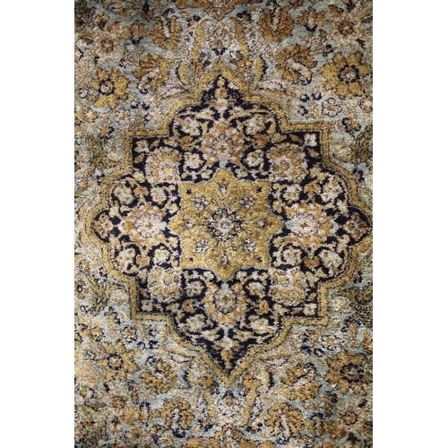 1004 - A PERSIAN STYLE RUG, turquoise ground with all stylised floral decoration. 6ft 8ins x 4ft 5ins.