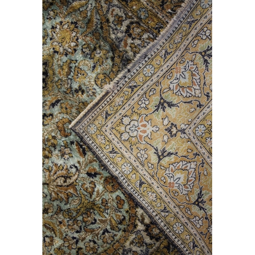 1004 - A PERSIAN STYLE RUG, turquoise ground with all stylised floral decoration. 6ft 8ins x 4ft 5ins.