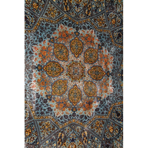 1007 - A FINE PERSIAN SILK RUG turquoise ground with stylised motifs and medallions. Signed. 6ft 6ins x 4ft... 