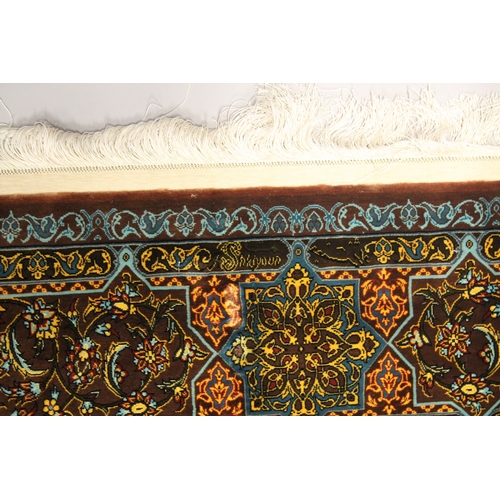 1007 - A FINE PERSIAN SILK RUG turquoise ground with stylised motifs and medallions. Signed. 6ft 6ins x 4ft... 